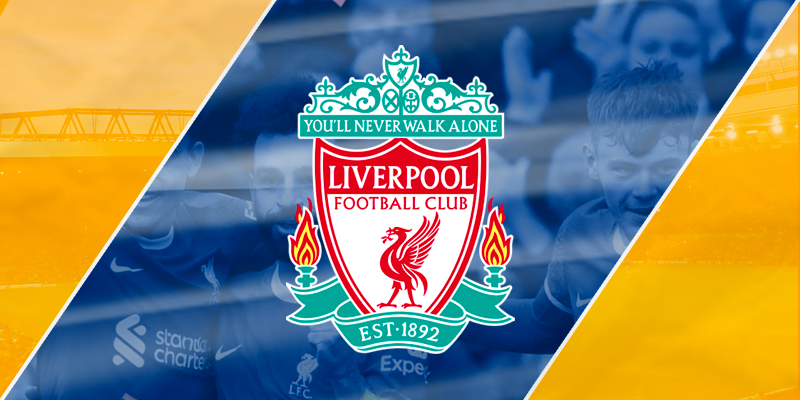 Liverpool Football Club crest and motto 'You'll Never Walk Alone' overlaid on a dynamic blue and orange background, symbolizing the team's Premier League lead.